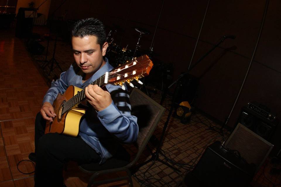 Omar playing the guitar