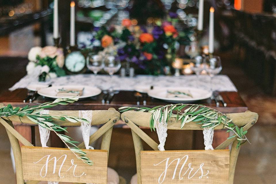 It's all about the details with these custom Mr. & Mrs chair signs.  Photo  by Natalie Watson Photography & Watson Studios.  Planning by Kevin Covey Wedding & Event Coordination.