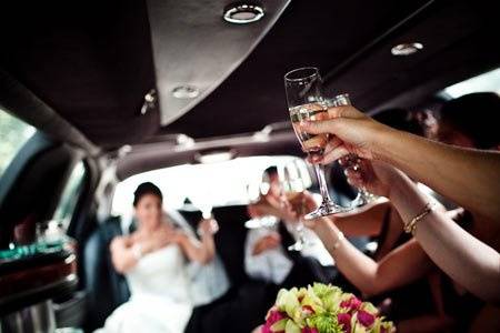 Bridal party celebrates in limo