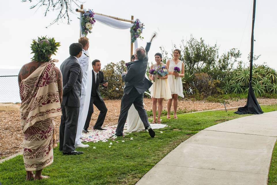 When the groom secretly plans to have a hang glider cruise by their ceremony to yell to the bride, 