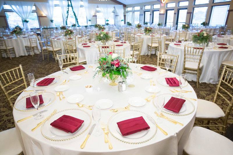 Table set-up with centerpiece red and white and gold