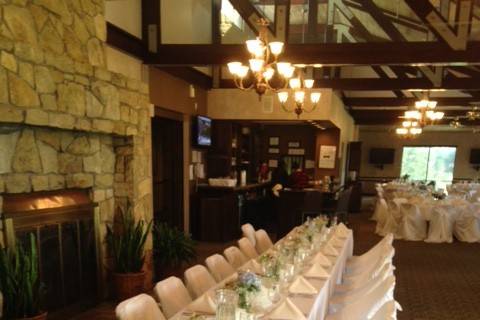 An elegant head table by the fireplace for a complete view of the venue.