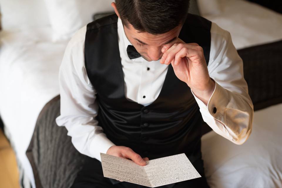 Groom Reading Letter
