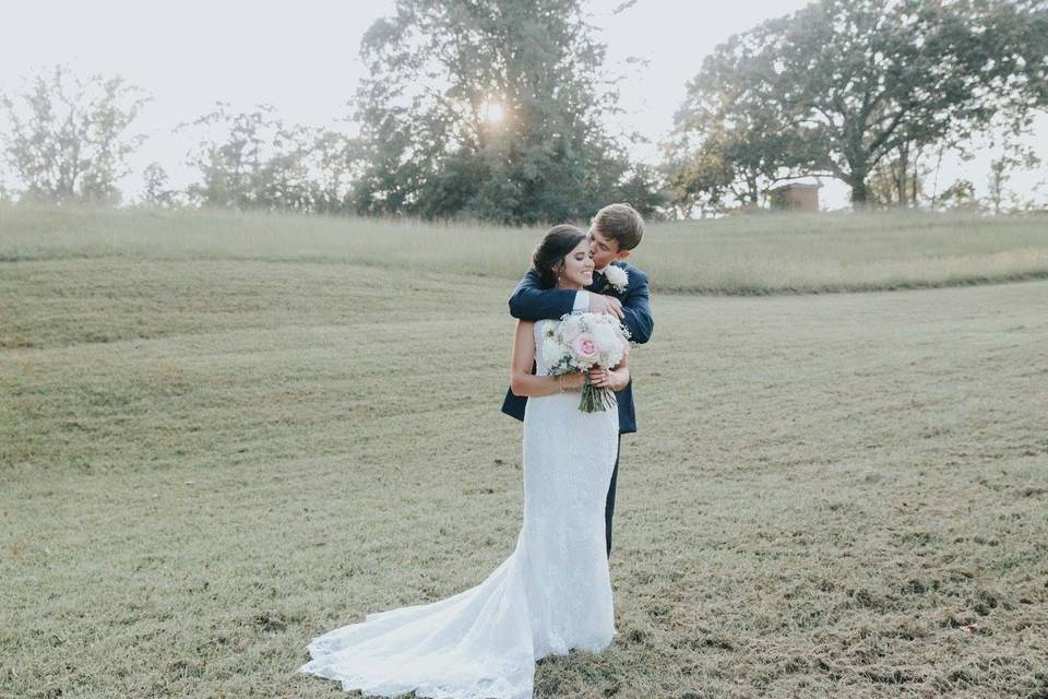 Newlyweds by the field