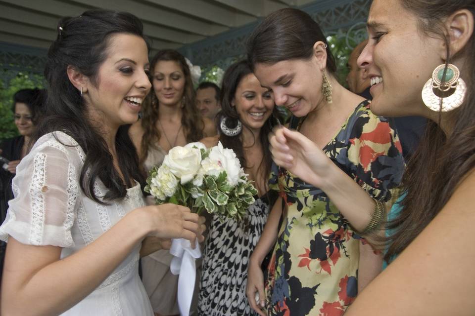 Bride laughs with friends after ceremony in Central Park's Ladies Pavilion