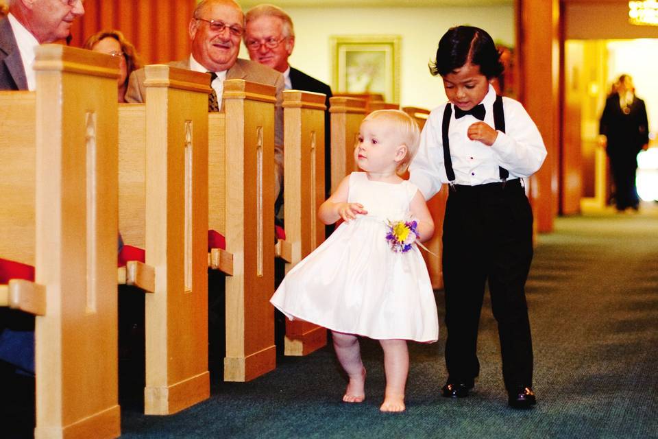 This 18-month old flower girl decided she did not like her new shoes! Photo courtesy of Deidre Lynn Photography
