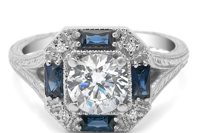 This art deco inspired ring has an engraved split shank and 4 beautiful french cut baguettes.