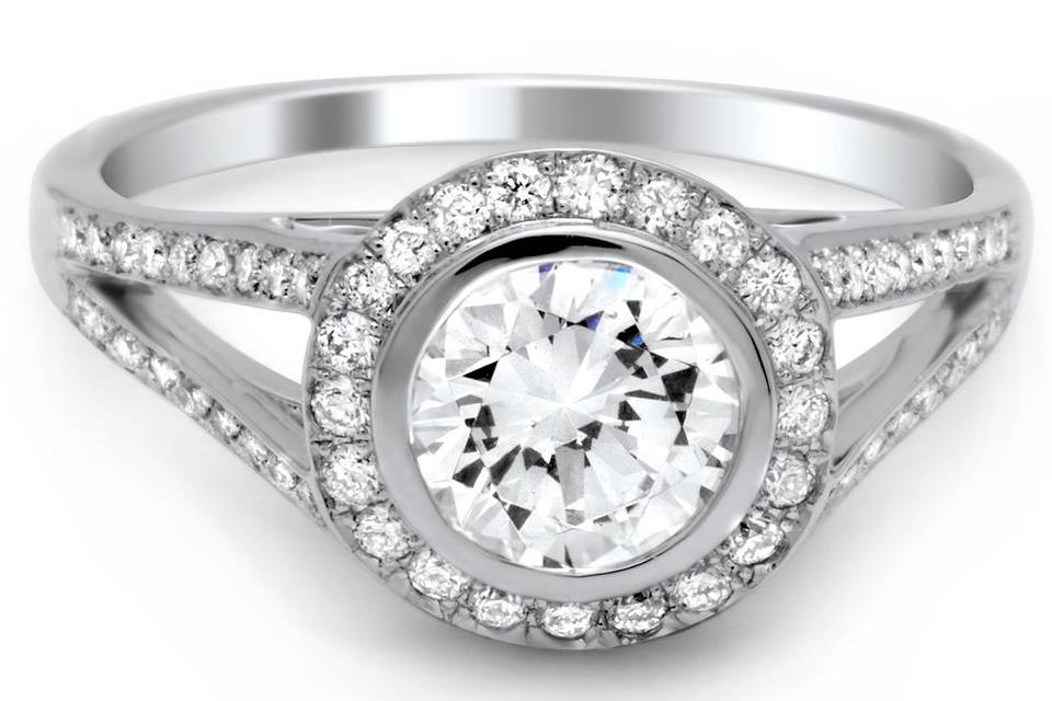 Like the bezel settings? Round bezel set halo ring with diamonds covering split shank.
