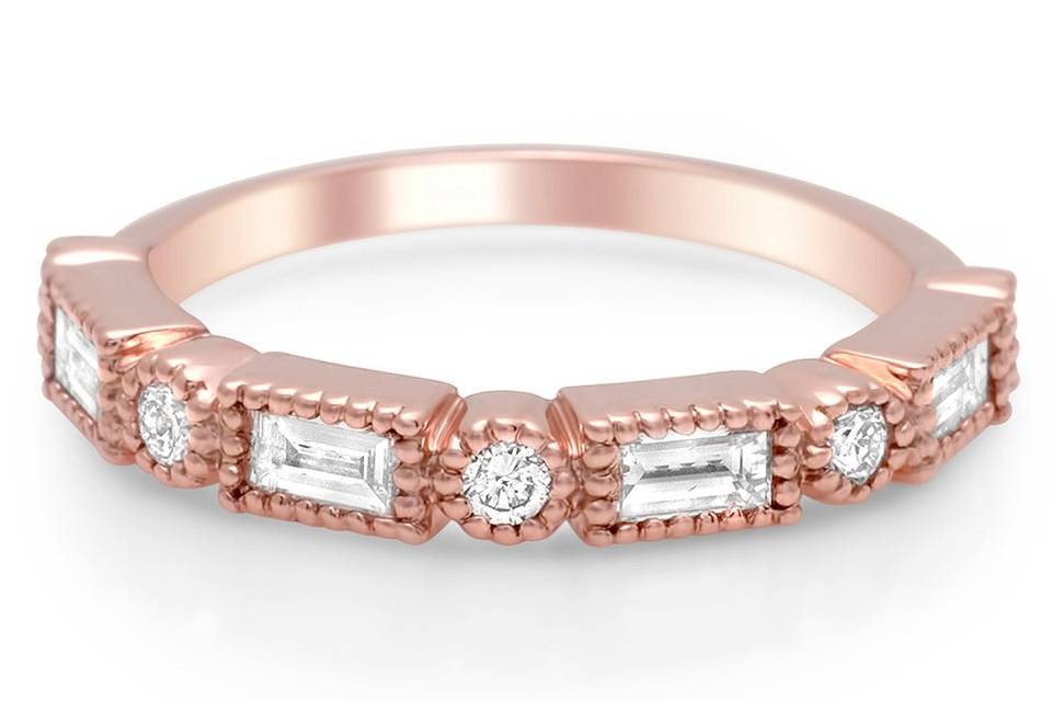 Rose gold round and baguette cut diamonds are bezel set and trimmed in milgrain.