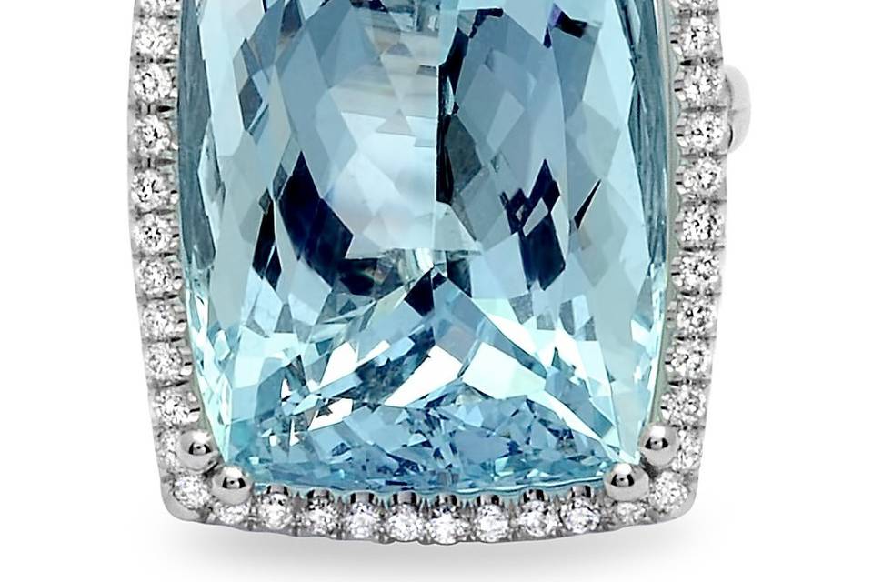 An example of one of our custom designs - 14+ carat aquamarine is set in a bed of pave diamonds.