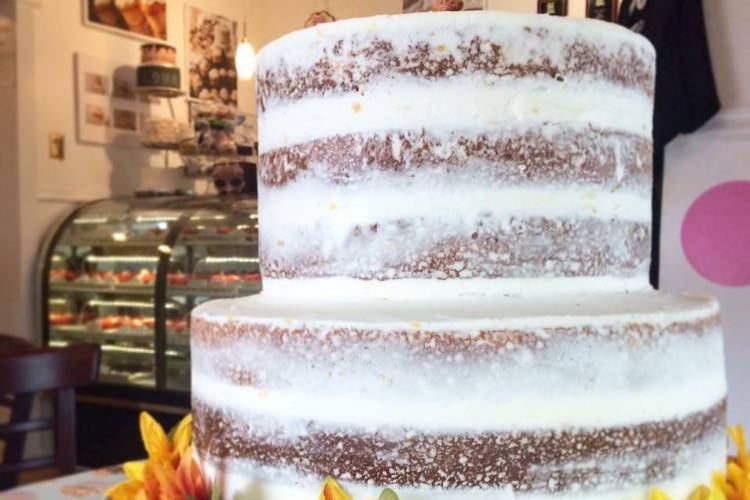 Naked cake decorated with flowers at the base