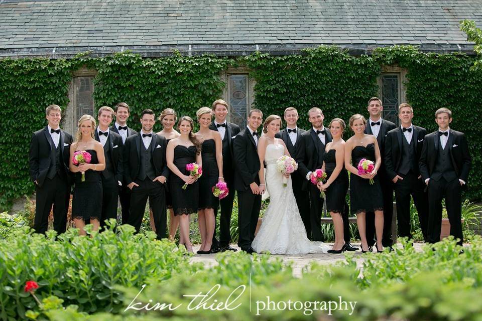 The couple with the bridesmaids and groomsmen