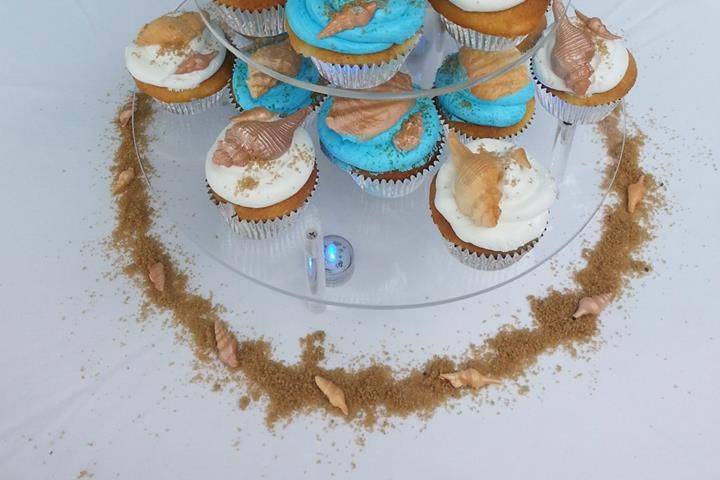 Tower of cake and cupcakes