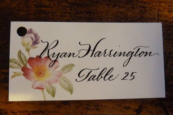Hand lettered escort cards by Jan Hurst.  These were attached with ribbon to horseshoes for a beautiful Kentucky wedding.