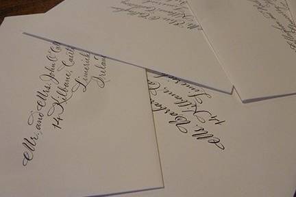 Sampling of wedding and save the date envelopes hand lettered by Jan Hurst.