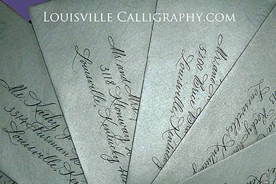 Silver invitation suite.  Handmade by Cartwheels, Louisville.  Calligraphy by Jan Hurst.
