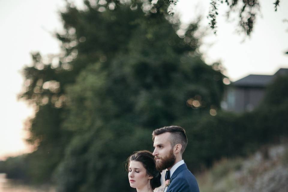 Couple pose by the lake