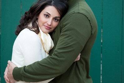 Couple beside green fence