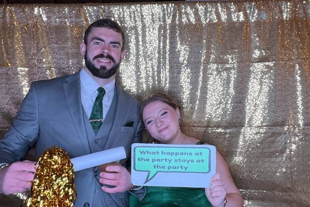 Couple posing with fun props