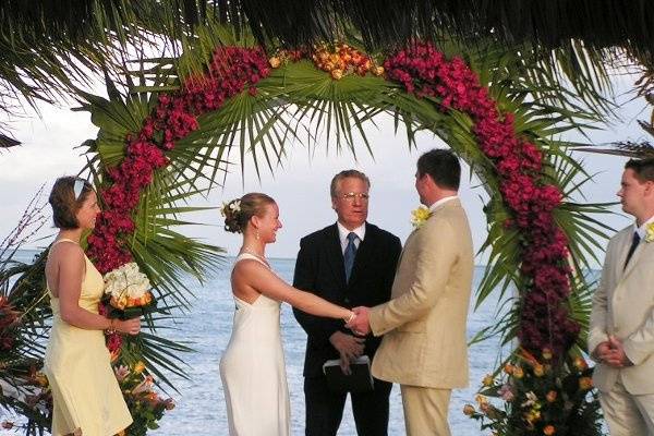 Ceremony under arch at beach