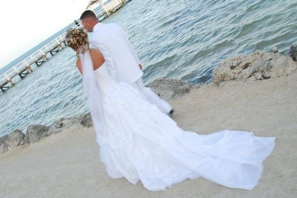 Newlyweds romantic walk along the beach