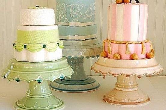 Little centerpiece cakes on matching hand made Clara French cake plates.