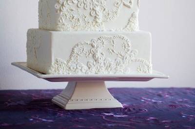 This cake displays detail from a gown, interpretted in sugar.