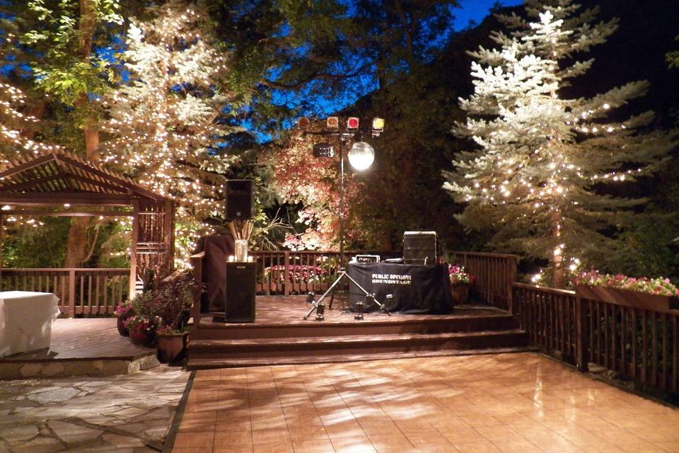 Lit up patio with dance floor, reception sound system