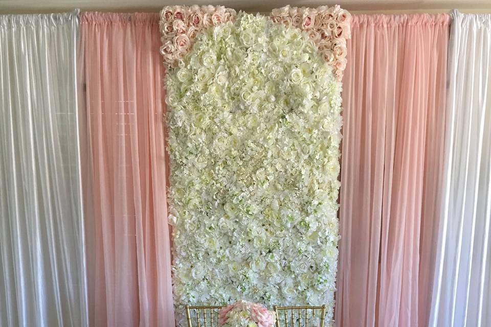Flowerwall with blush accents, drapes and rose gold sequin linen