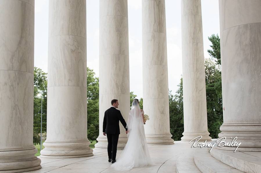 Newlyweds by the columns