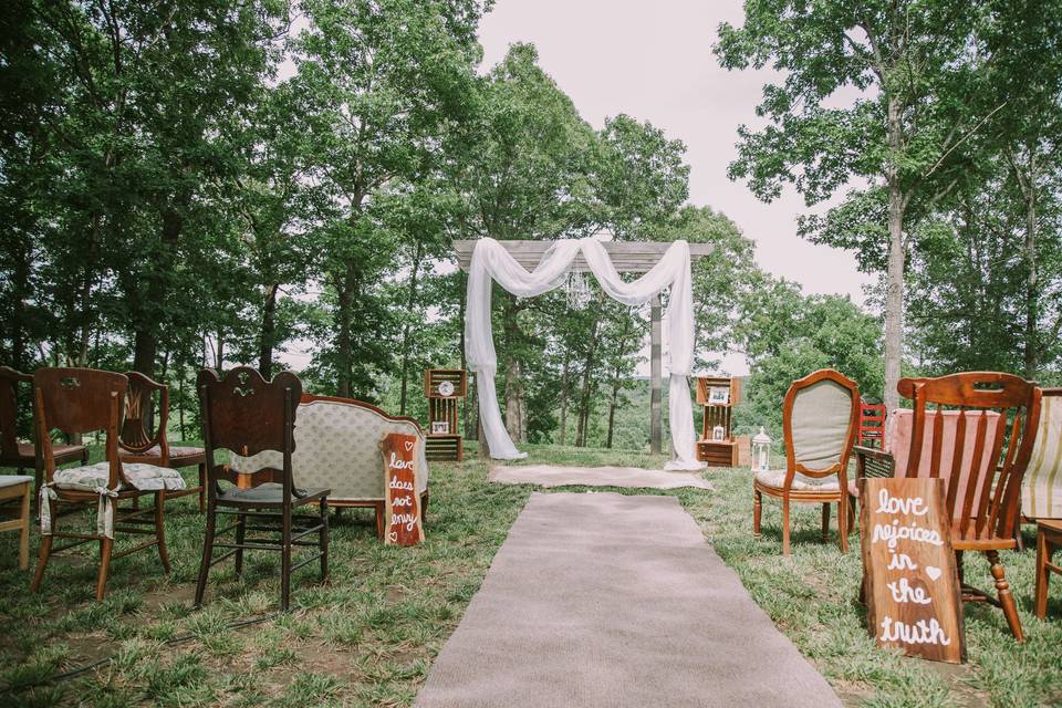 Aisle signs mixed with antique seating