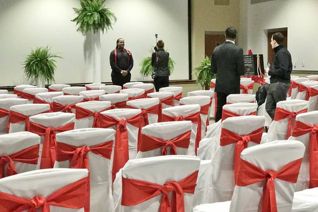 White chairs with red bows