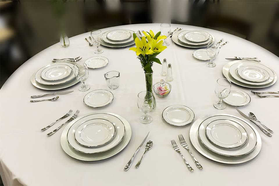 All white table setup with a touch of yellow