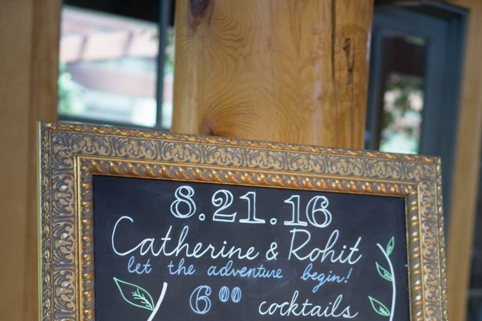 Chalkboard Program sign. Photo Credit: Naomi Yata, Chalkboard design: Emily Ruth Prints.