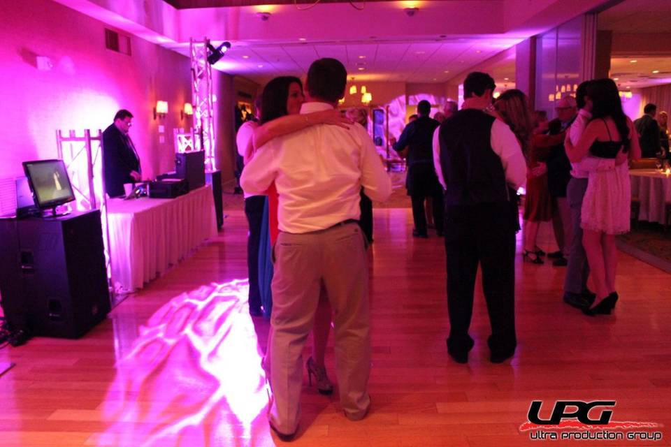 Some guests dance to our professional DJ setup.