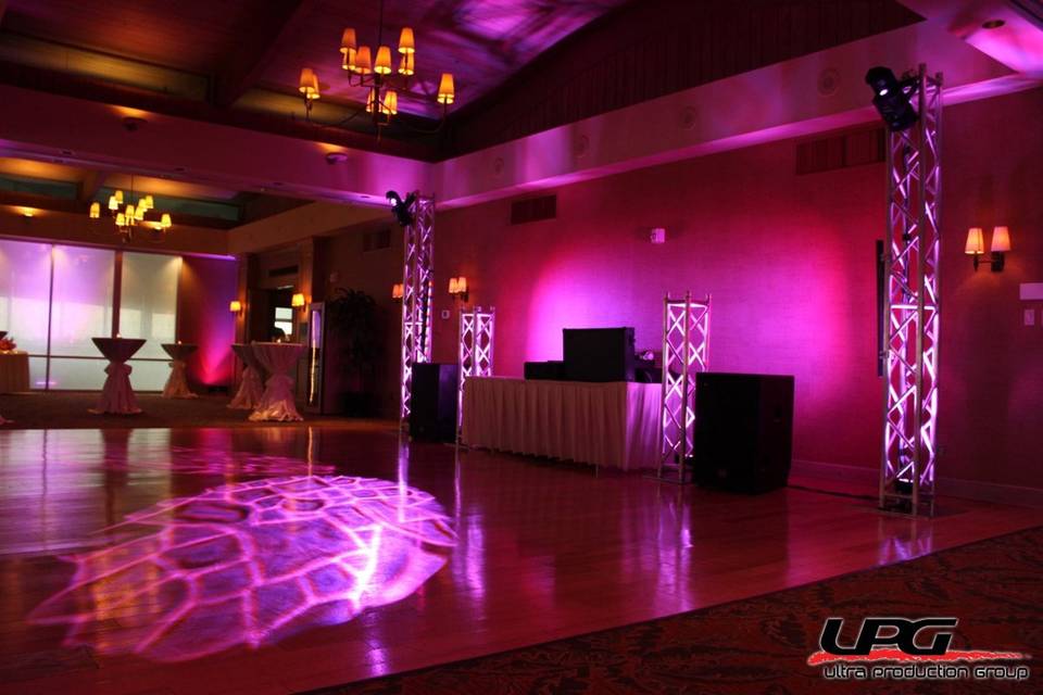 Our DJ setup is the best in the business. For weddings it elegant and can be tailored to your personal taste. This setup uses led lighting to theme the whole room together and truss towers add to a nice feel.