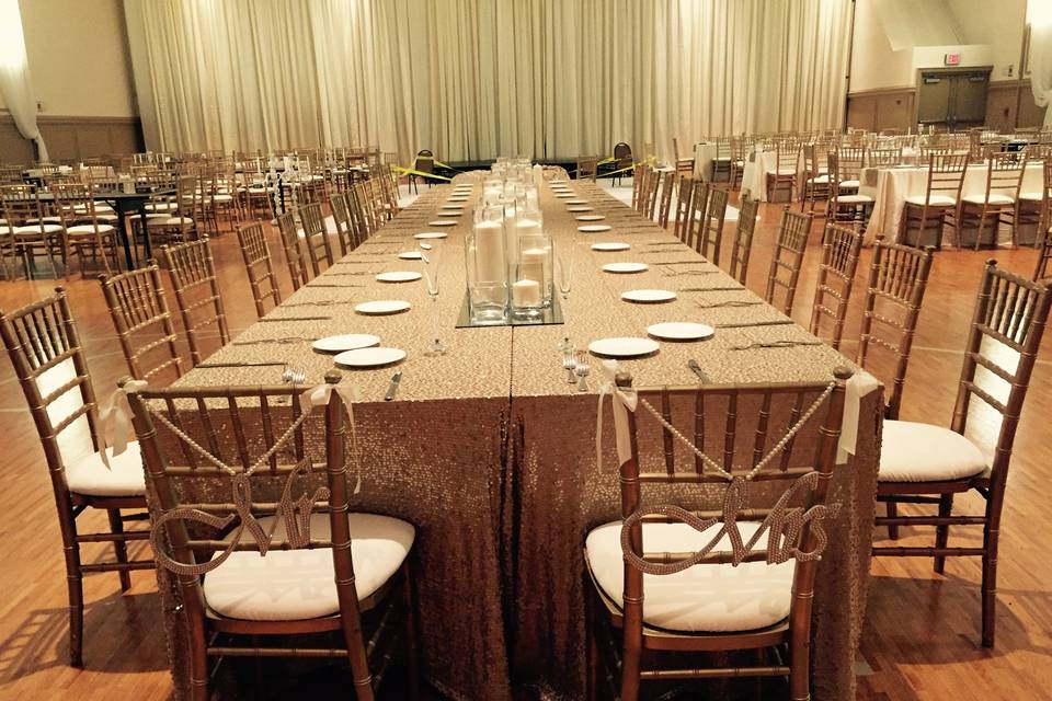 Long tables with brass chairs