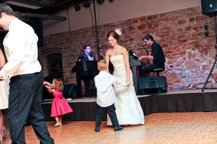Bride and junior escort dancing