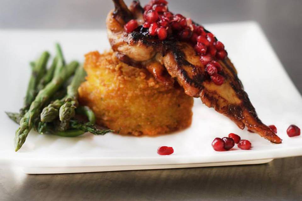 Pomegranate glazed chicken breast with jasmine rice cake and asparagus