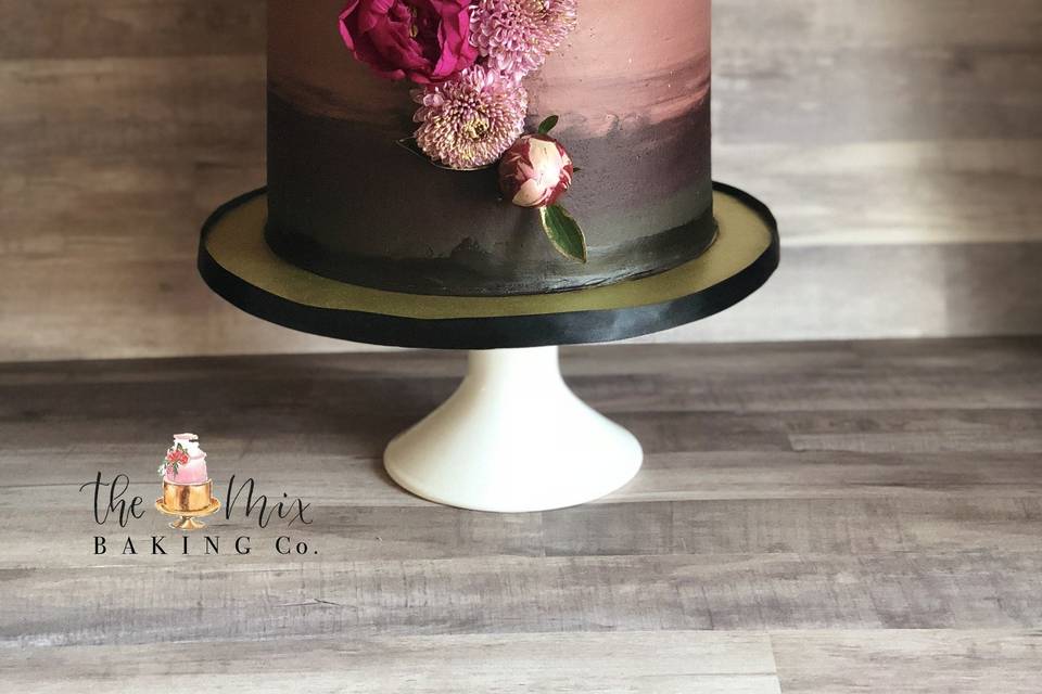 Deep and dark romance watercolour buttercream cake with floral cascade