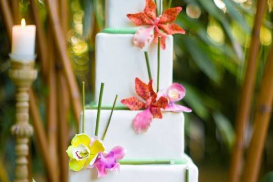 White wedding cake with summer flowers