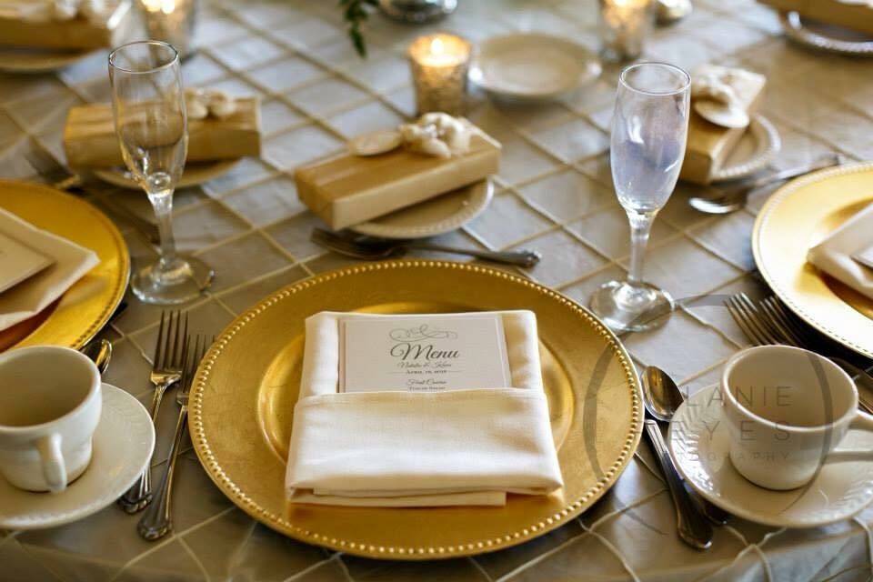 Ivory pintuck linen with Gold chargers seen here.