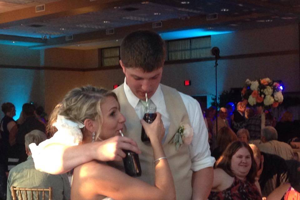 Bride and groom share some root beer