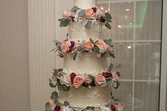 Five-tier wedding cake with florals