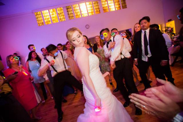 The bride and guests dancing