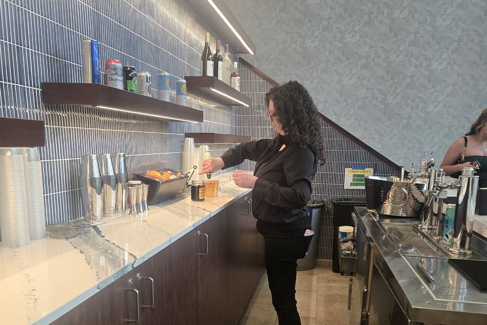 Brianna bartending