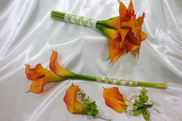 Terra Cotta orange calla lilies in this wedding package.