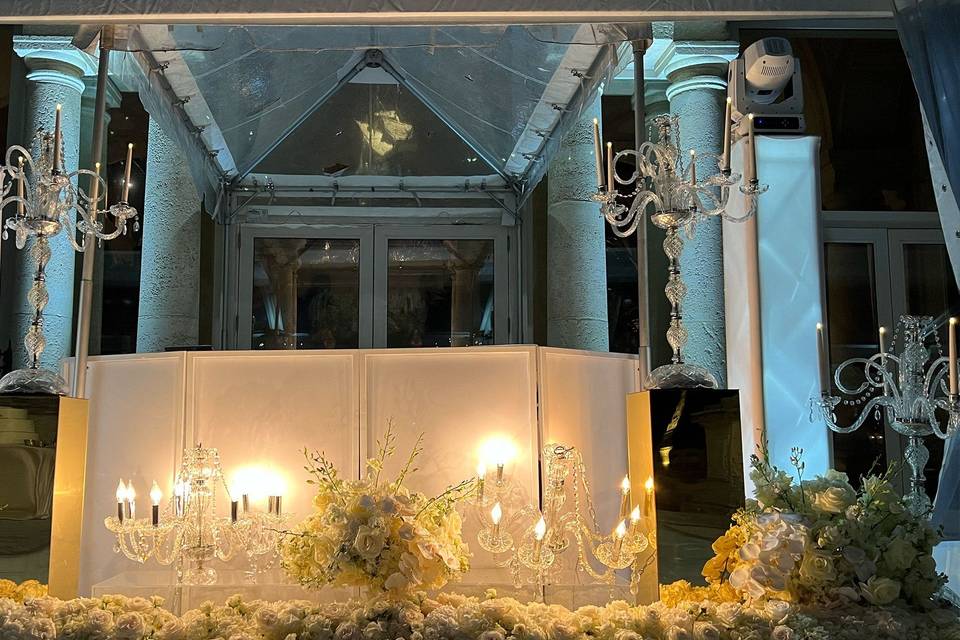 White facade and candelabras