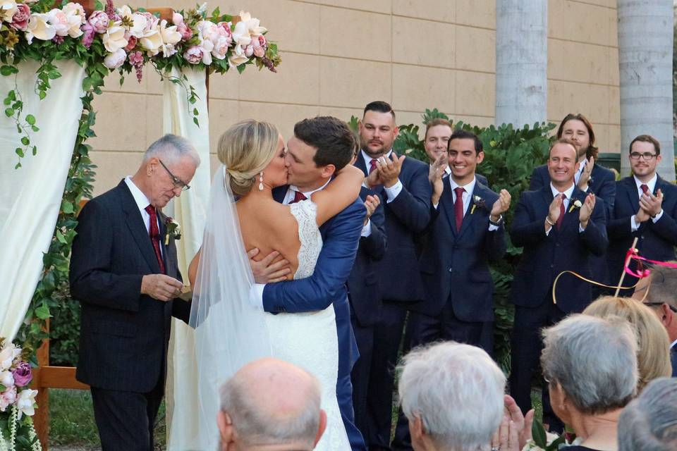 Wedding ceremony couple kiss