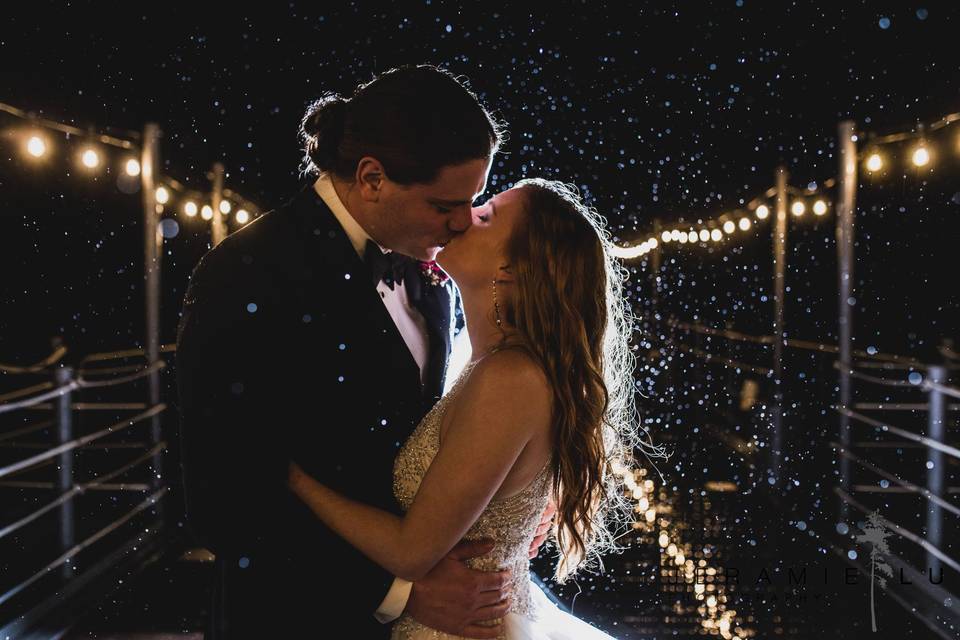 Rainy day wedding kiss